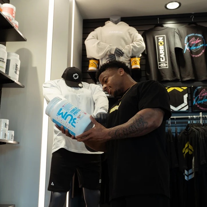retail man shopping for protein powder at carbon performance gym retail store in nashville tn and franklin tn