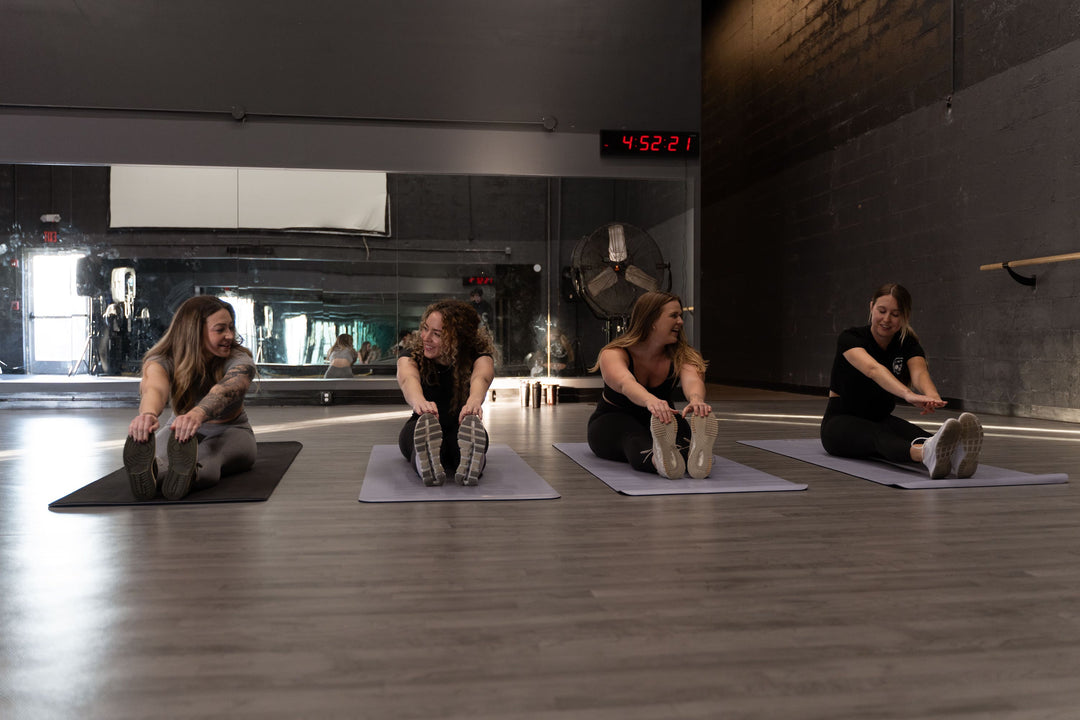 Women stretching at a group fitness class in Franklin, TN