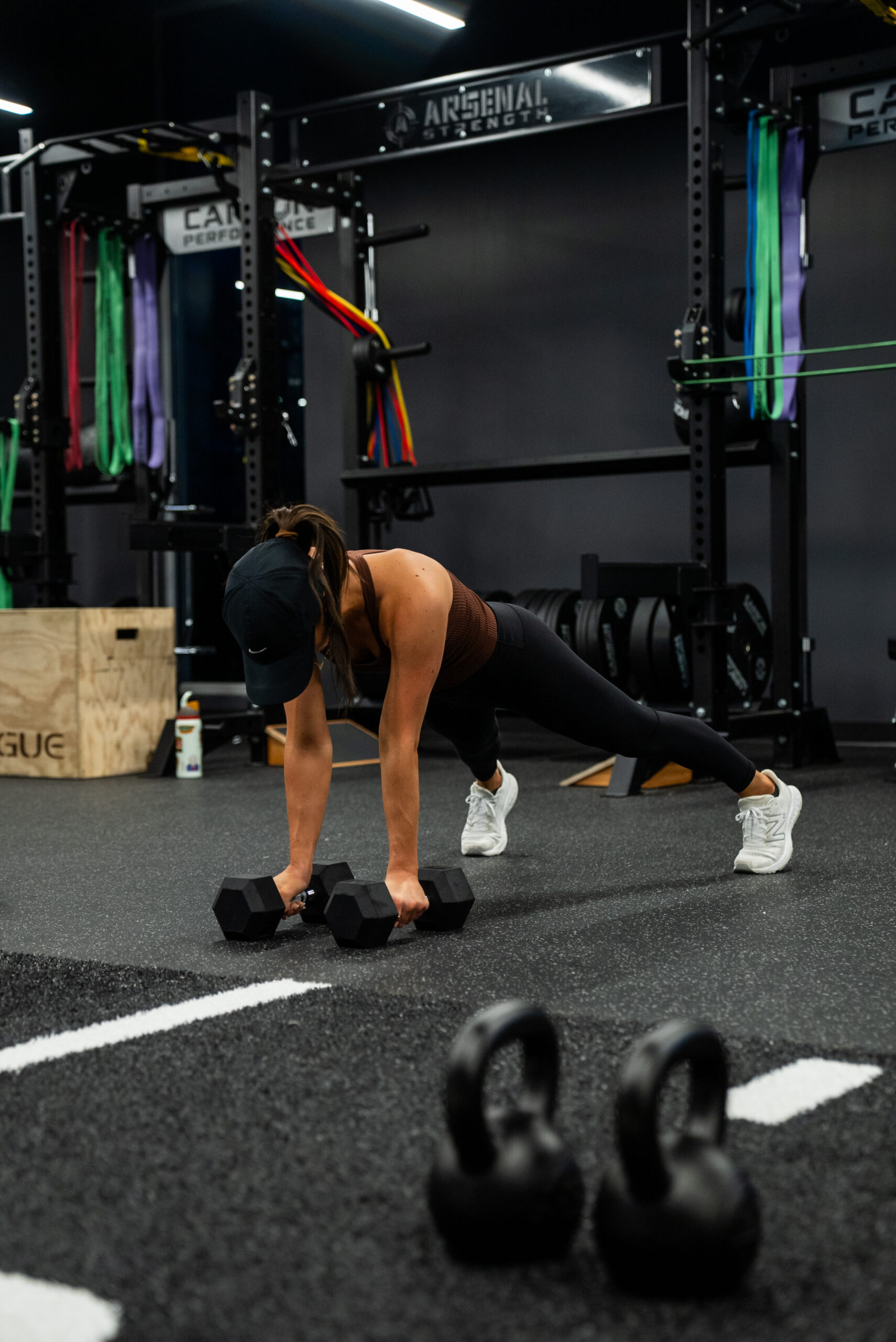 A woman working out at Carbon Performance