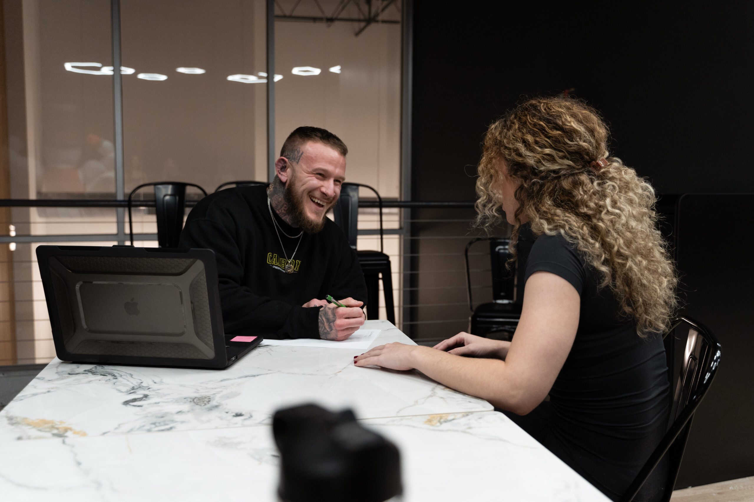 Carbon Performance employee smiling with client