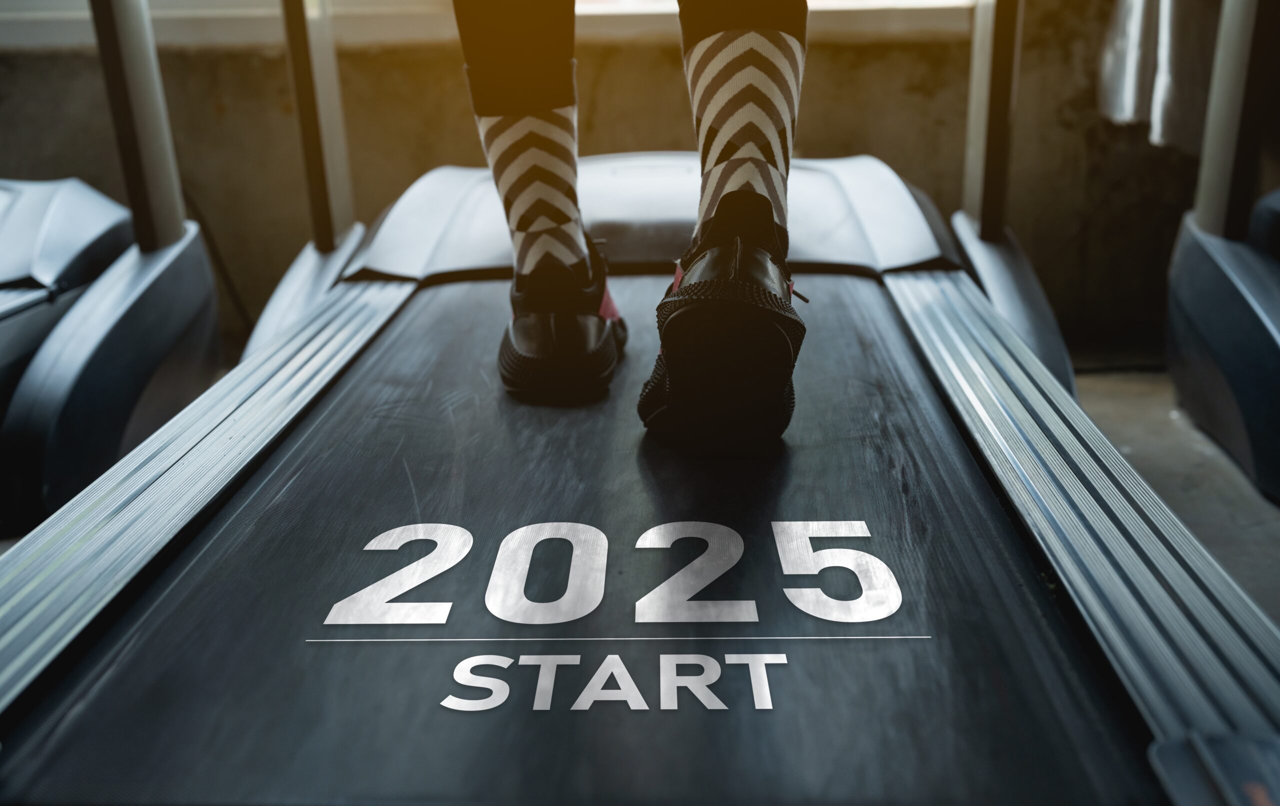 Image on treadmill with "2025 Start" graphic on treadmill.