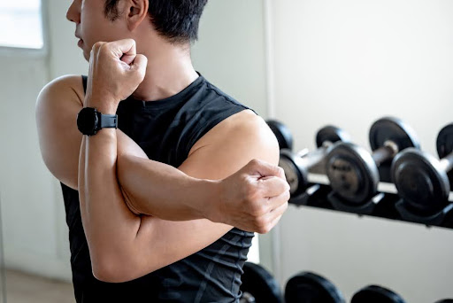Man warms up before his workout for better results.