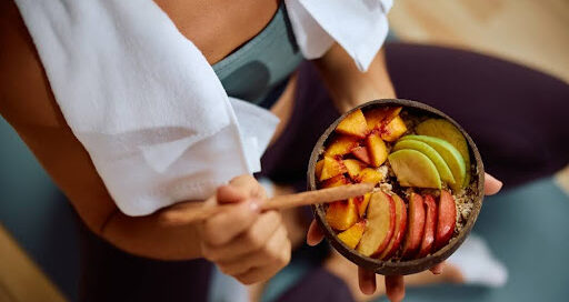 Woman eating balanced meal after workout.