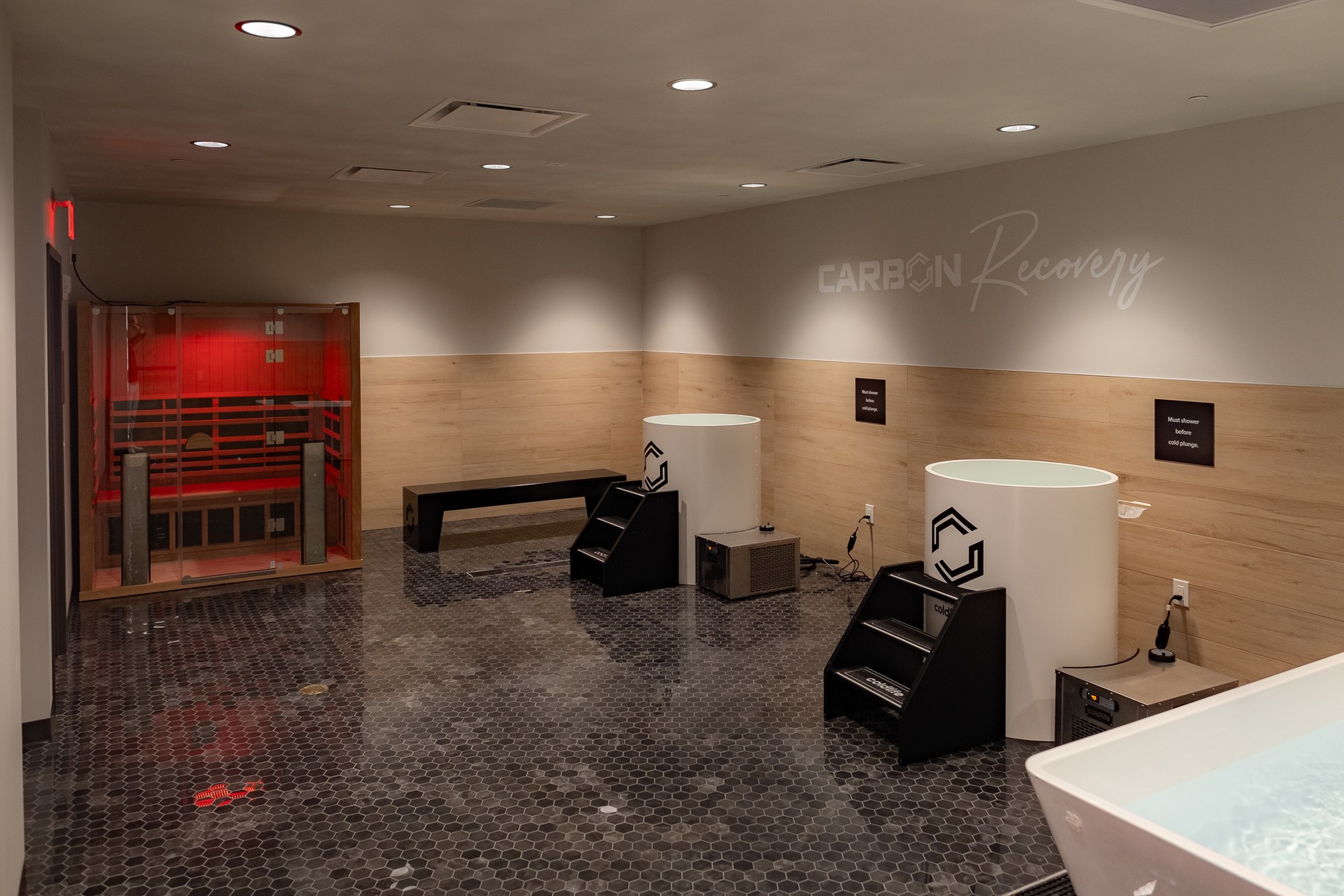 Recovery lounge with infrared sauna and cold plunge at Carbon Performance